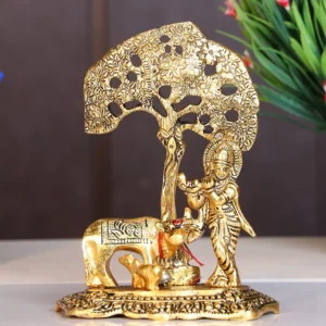 Kamdhenu Cow with Krishna Standing Under Tree Plying Flute Metal Statue (12 X 8 X 17 cm, Gold)